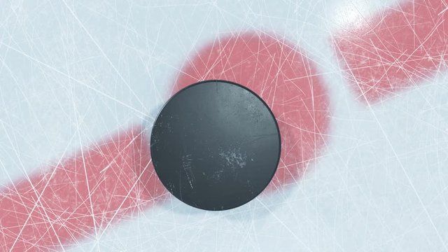 Close-up Hockey Puck Drop in Face-off Zone. 3d animation of Hockey-puck Falling on Ice with and without DOF Blur on Green Screen Alpha Mask. Active Sport Concept. 4k UHD 3840x2160.