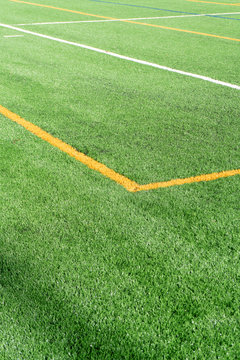 Soccer field with new artificial turf field. Close up. Soccer background. Copy space