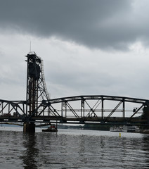 steel framed bridge and tower over water