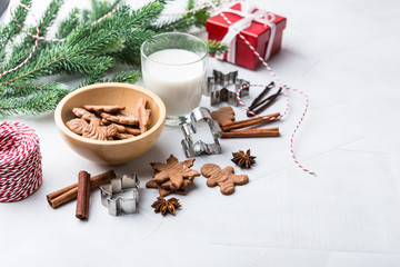 Obraz na płótnie Canvas Christmas gingerbread cookies with glass of milk