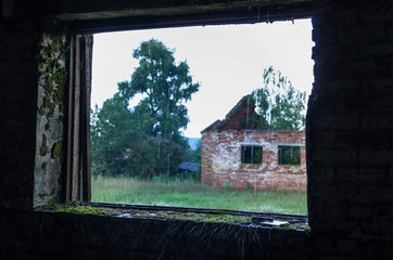 View from the window. View of an abandoned house.