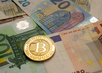 golden bitcoin coin on euro close up