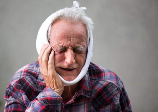 Elderly Man With Toothache