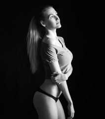 Young sexy girl posing at underwear black and white