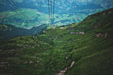 Ski lift on the mountain Chaserrugg in Switzerland overlooking the town of Wildhaus. Amazing scenic spots in the mountains. Popular tourist destination. Travel to Switzerland