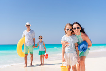 Portrait of happy family on a tropical beach