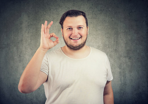 Happy man showing OK sign