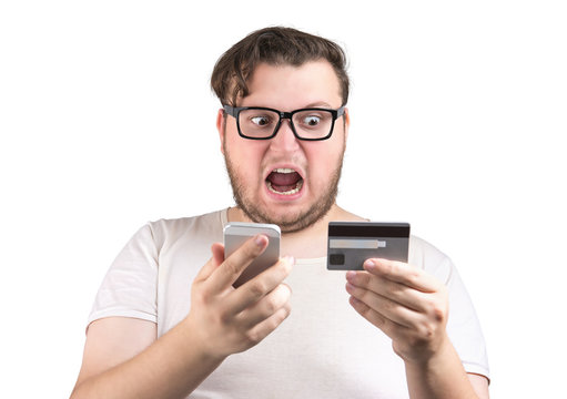 Screaming man with credit card and phone