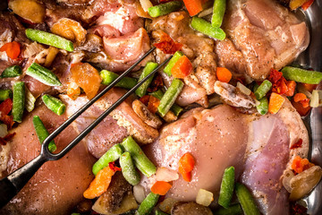 Prepared for baking chicken meat with vegetables.