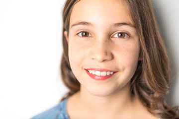 Naklejka premium A Portrait of a child girl on studio white