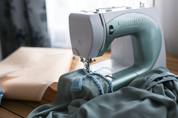 sewing machine and fabric with patterns on table
