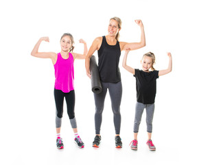 Obraz premium A Proud to be strong and healthy. Happy sporty family on studio white background