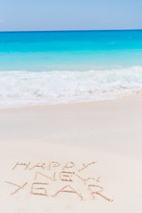 2018 inscription written on sandy beach, New Year greeting card.