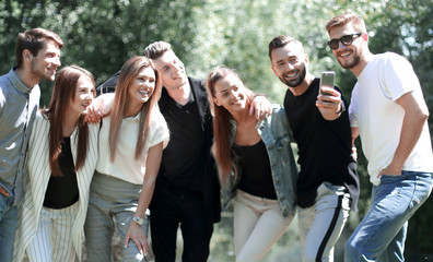 group of happy young men pointing at you.