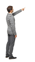 Side view of pointing business man. gesticulating young guy in s