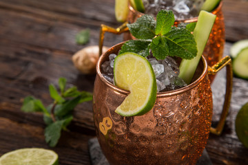 Famous Moscow mule alcoholic cocktail in copper mugs.