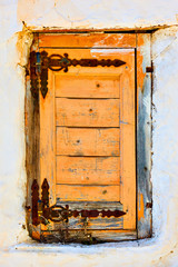 Window with closed old wooden shutter