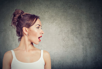 Closeup side view profile portrait woman talking with open mouth