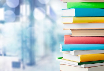 Books collection in pile on  background.