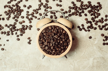 Coffee cup and roasted beans arranged as clock face top view. Coffee time symbol