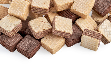 heap of mixed square wafer biscuits isolated on white background.