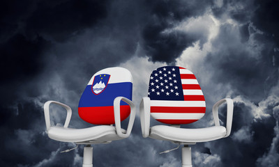 Slovenia and USA business chairs. Internationl relationship concept. 3D Rendering