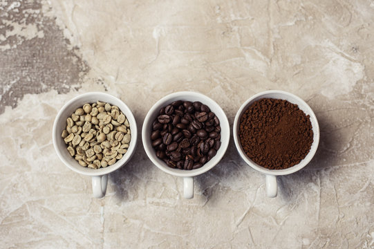 Different types of coffee - ground, grain and unroasted