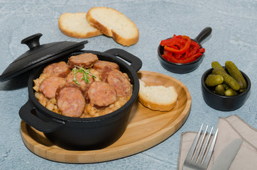 Cassoulet. Baked beans and sausages. Sausage cassoulet.  