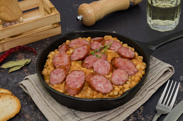 Cassoulet. Baked beans and sausages. Sausage cassoulet.  