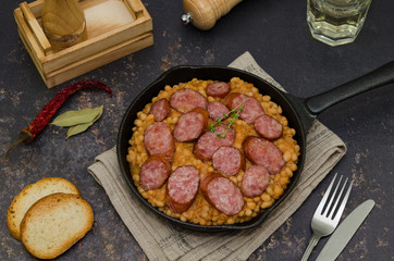 Cassoulet. Baked beans and sausages. Sausage cassoulet.  