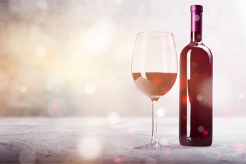 Red wine glass and bootle with shadow on withe background