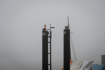 Port poles in Fog - obrazy, fototapety, plakaty