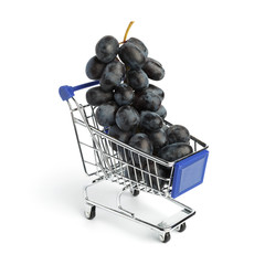 Bunch of ripe black grapes in the grocery cart on a white background. Conceptual photo