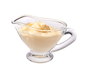 Mayonnaise in glass bowl on white background