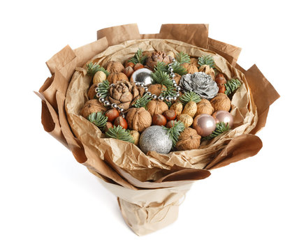 Beautiful Christmas decorative bouquet of various nuts, decorated with twigs of Christmas tree and balls. Top view