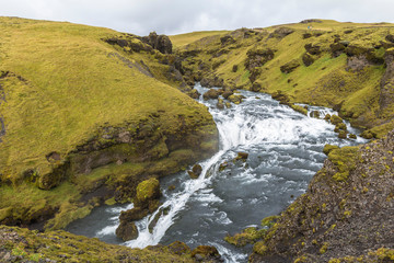 Fototapeta premium River in beautiful icelandic landscape near Skogafoss, Iceland