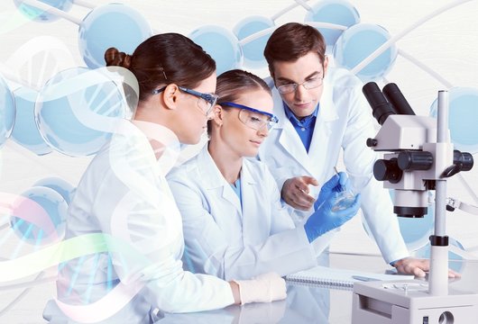 Female and male scientists in glasses working with microscope