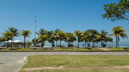 Fototapeta na wymiar View of beachfront with kiosk and chairs