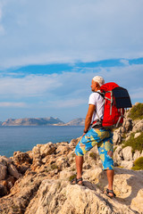 Fototapeta premium Alone traveler use portable solar panel