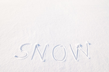 Word snow written in fresh powder snow