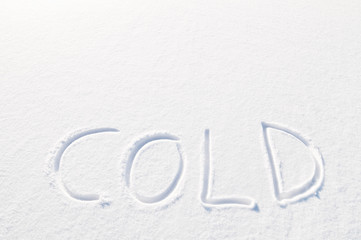 Word cold written in fresh powder snow