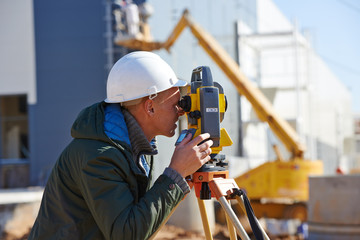 surveyor worker with theodolite
