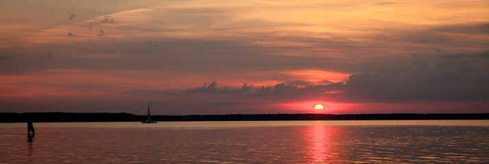 Beautiful summer sunset in the lake Svityaz. Sunset Background