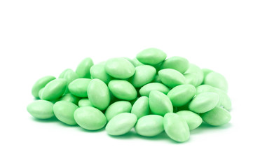 Pile of Green Candy Coated Chocolate Gems on a White Background