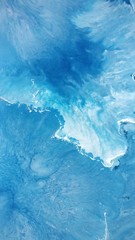 Creative abstract hand painted background, wallpaper, texture, close-up fragment of acrylic painting on canvas. Modern art. Contemporary art. Fluid art. 