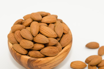Bowl of almond nuts on white background. Almond nuts isolated. 