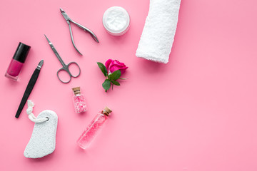 tools for manicure with spa salt and rose on pink background top view mockup