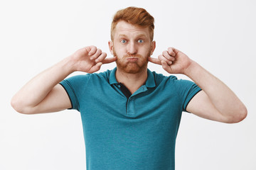 Waist-up shot of carefee playful and cute redhead boyfriend in green trendy polo, pouting and...