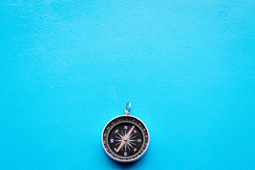 direction and movement concept with compass on wooden background top view mock up
