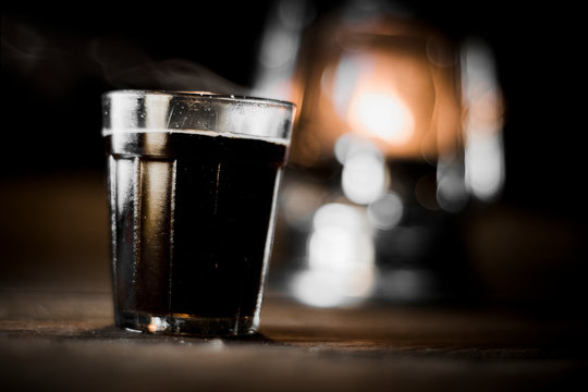 Black Tea on Wooden Table with Beautiful Glowing lantern Environment  Tea, Smoke, black, blur, brew, make, pour, shed, drinking tea